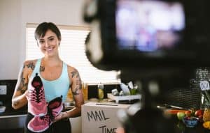 A woman capturing photos for her video marketing content