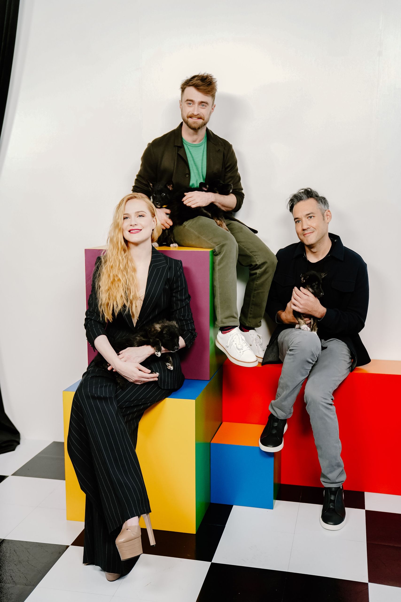 Three actors posing on colorful geometric blocks in studio — Toronto talent and actor group portrait photography by Origin Films