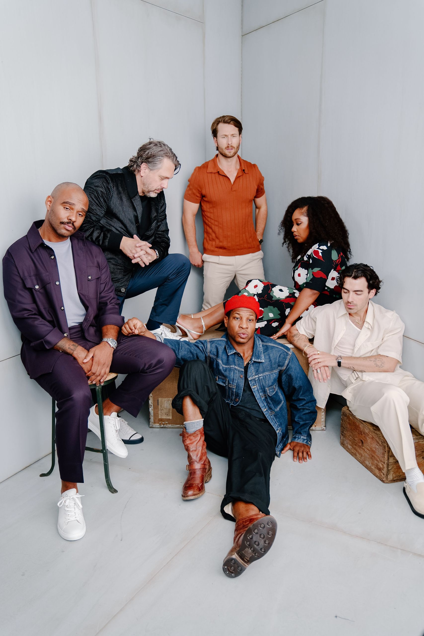 Five diverse actors posing together in minimal white studio — Toronto talent casting group portrait photography by Origin Films