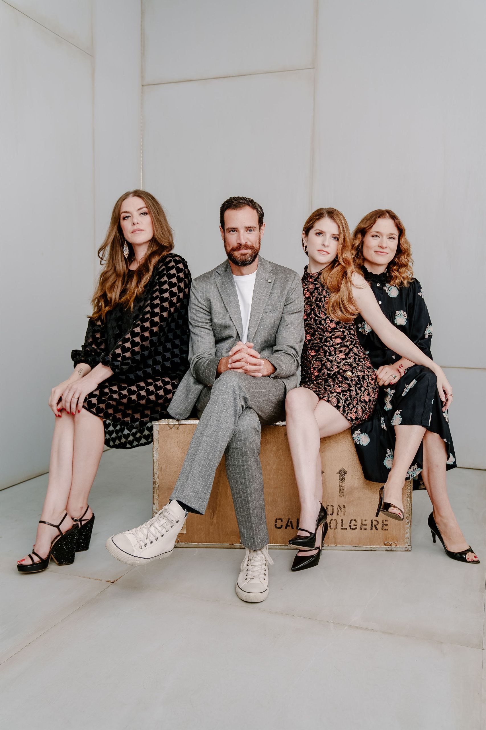 Four actors seated on wooden crate in studio — Toronto group portrait photography by Origin Films